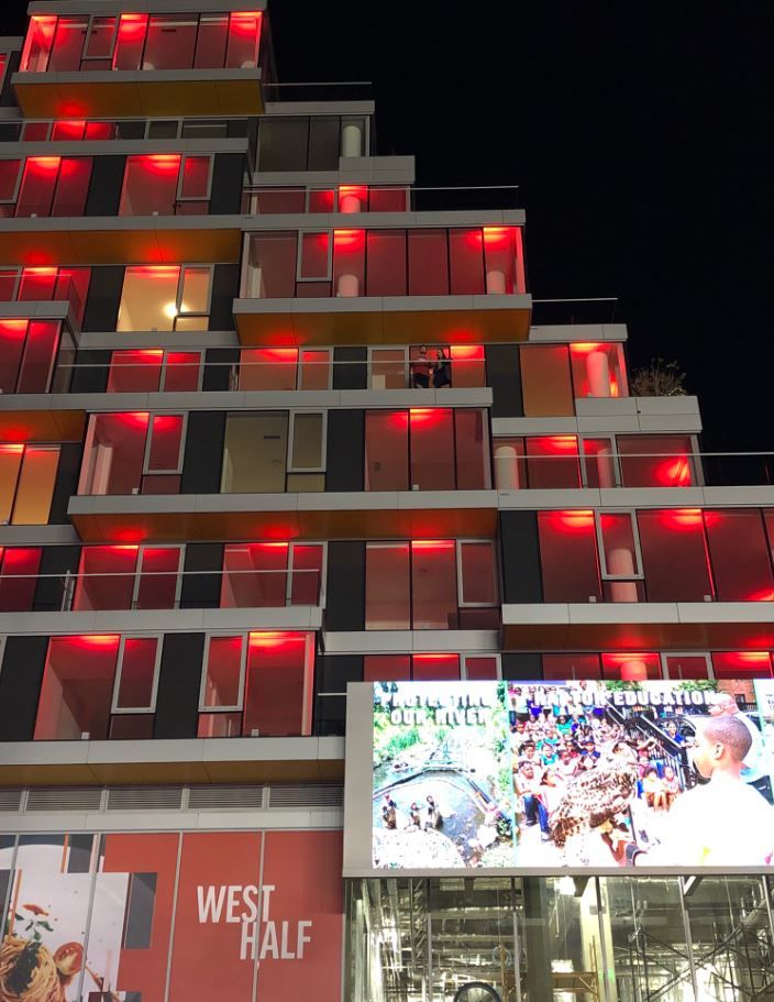 Nats fans from an apartment building near the stadium show their support.