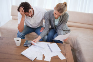 Depressed couple doing their accounting