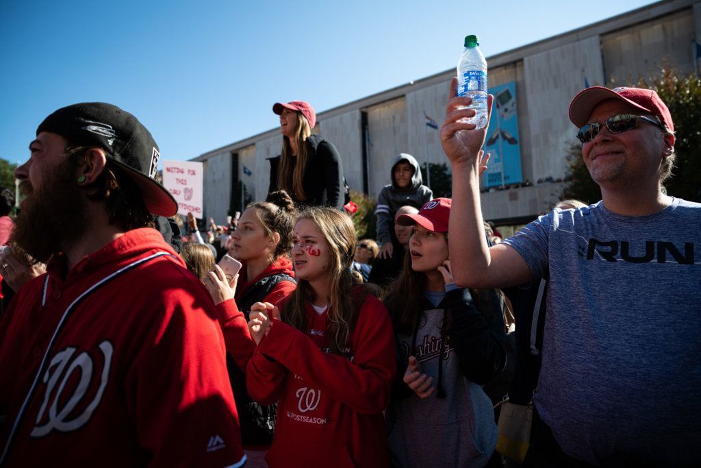 Nationals fans cheer the team's first-ever victory parade for a World Series title.