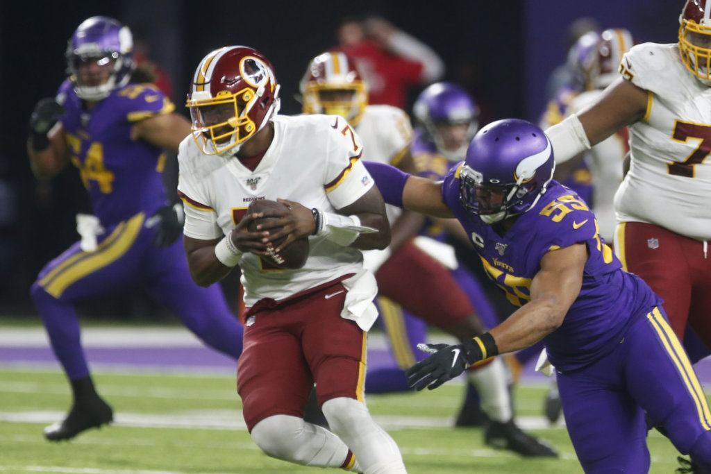 Washington Redskins quarterback Dwayne Haskins (7) is sacked by Minnesota Vikings outside linebacker Anthony Barr (55) during the second half of an NFL football game, Thursday, Oct. 24, 2019, in Minneapolis.