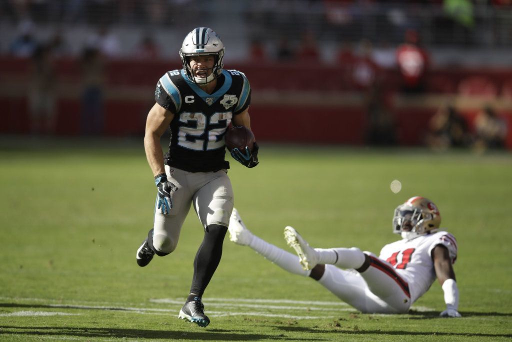 Carolina Panthers running back Christian McCaffrey runs with the ball for a touchdown past San Francisco 49ers defensive back Emmanuel Moseley, during the second half of an NFL football game in Santa Clara, Calif., Sunday, Oct. 27, 2019.