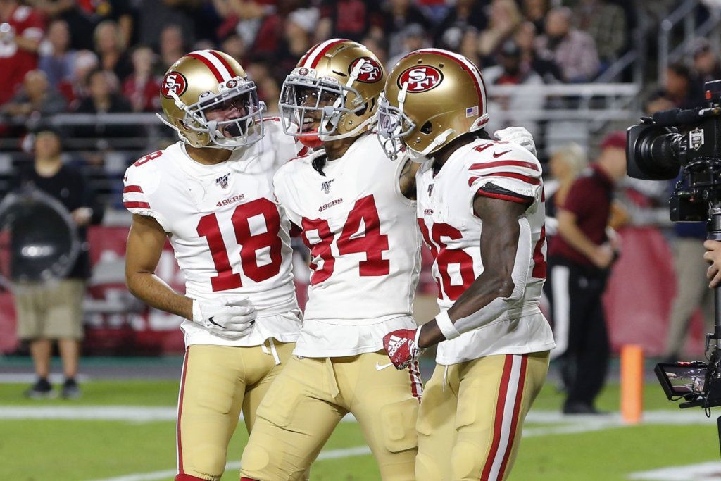 San Francisco 49ers wide receiver Kendrick Bourne (84), celebrates his touchdown against the Arizona Cardinals, with wide receiver Dante Pettis (18) and running back Tevin Coleman (26) during the first half of an NFL football game, Thursday, Oct. 31, 2019, in Glendale, Ariz.
