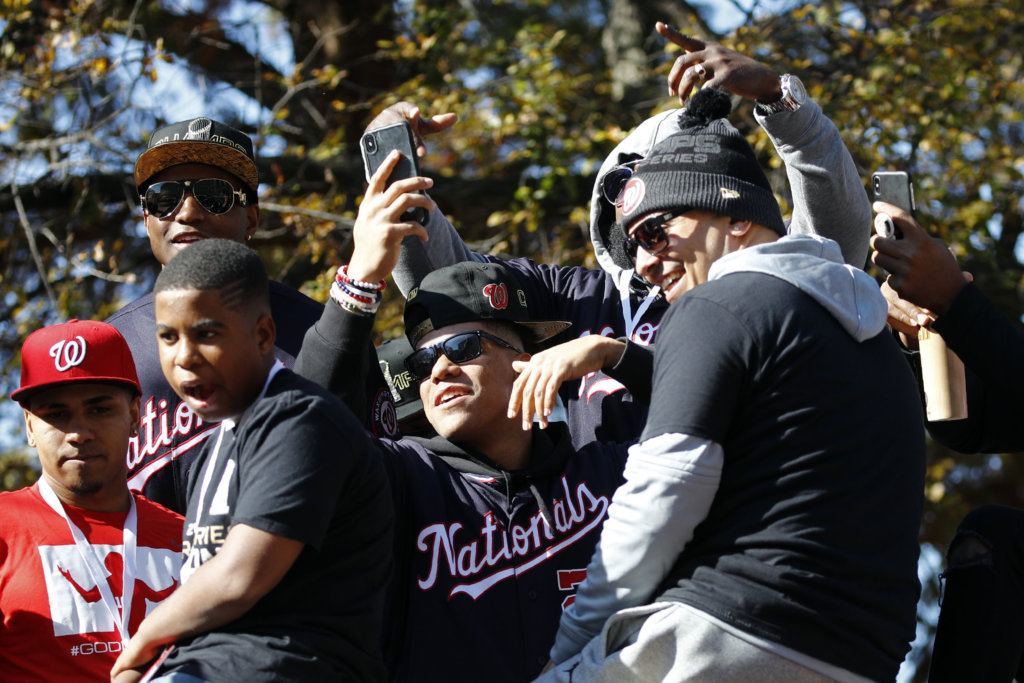 Washington Nationals left fielder Juan Soto, center, celebrates with teammates before a parade to celebrate the team's World Series baseball championship over the Houston Astros, Saturday, Nov. 2, 2019, in Washington.