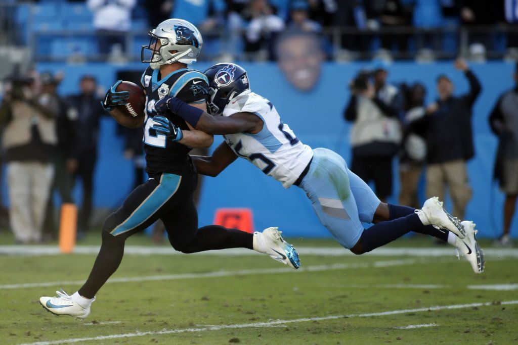 Carolina Panthers running back Christian McCaffrey runs for a touchdown while Tennessee Titans cornerback Adoree' Jackson tackles during the second half of an NFL football game in Charlotte, N.C., Sunday, Nov. 3, 2019.