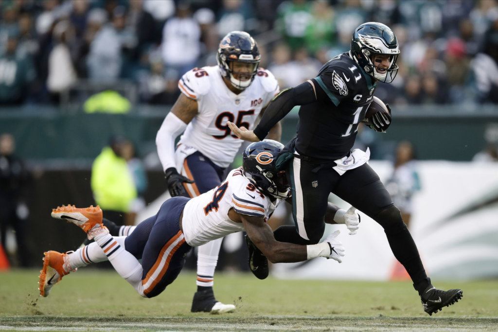 Philadelphia Eagles' Carson Wentz, right, is tackled by Chicago Bears' Leonard Floyd during the second half of an NFL football game, Sunday, Nov. 3, 2019, in Philadelphia.
