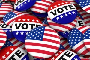 US Elections Concept United States Flag and Vote Badges