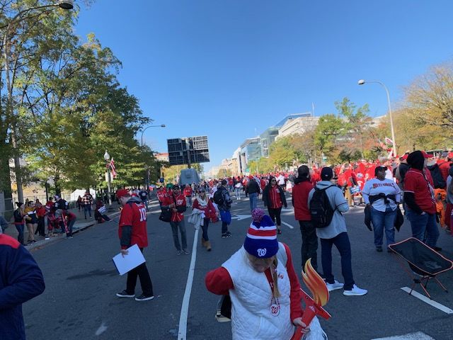 People begin the search for a good spot before the parade kicks off at 2 p.m.