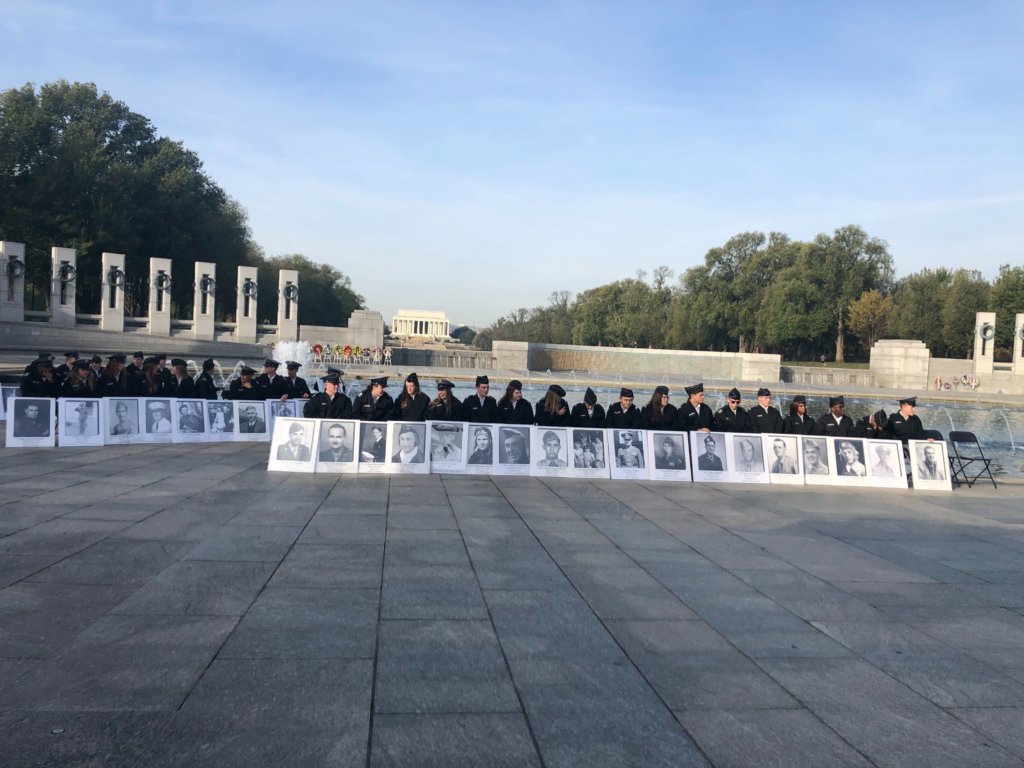 Current service members honor veterans during a special ceremony at the WWII Memorial in D.C. on Monday.
