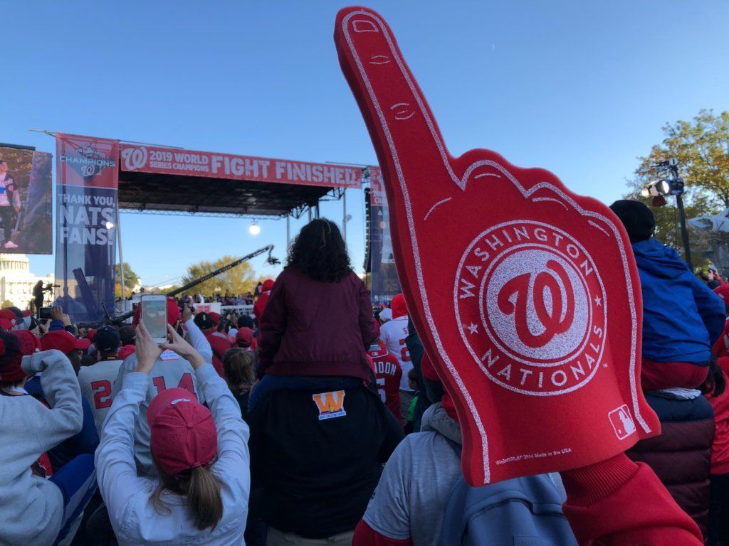 Fans watch players as they're honored on stage at the Washington Nationals victory celebration.