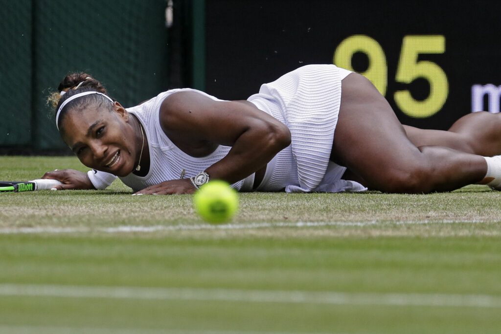 United States' Serena Williams falls while attempting to return the ball to United States' Alison Riske during a women's quarterfinal match on day eight of the Wimbledon Tennis Championships in London on July 9, 2019.