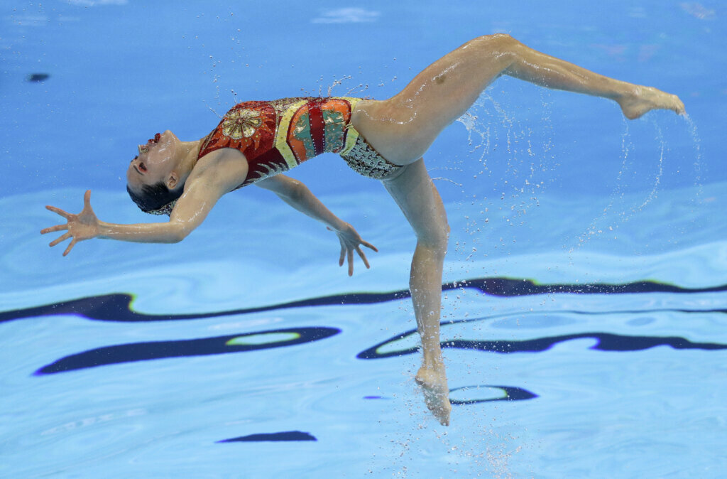 A swimmer from China performs during the artistic swimming team free preliminary event at the World Swimming Championships in Gwangju, South Korea, on July 17, 2019.