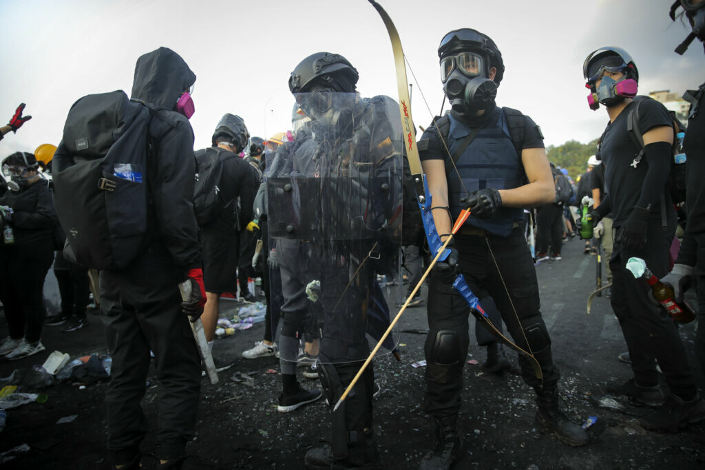 Student protesters with their homemade gear take their positions outside the Chinese University of Hong Kong on Nov. 13, 2019.