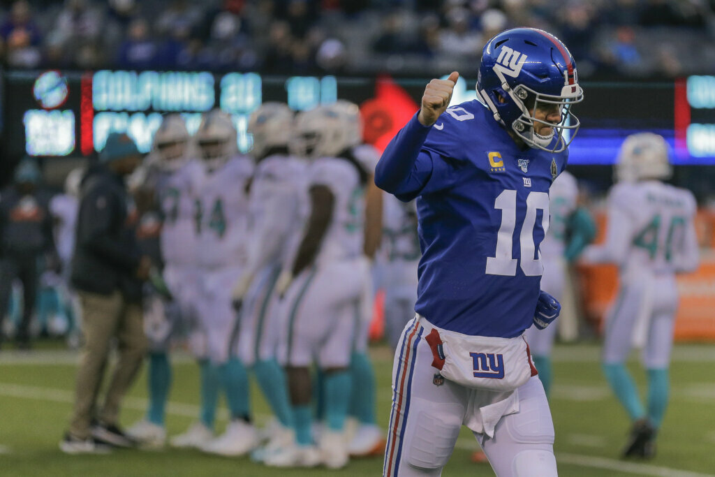 New York Giants quarterback Eli Manning (10) runs off the field during the fourth quarter of an NFL football game against the Miami Dolphins, Sunday, Dec. 15, 2019, in East Rutherford, N.J.