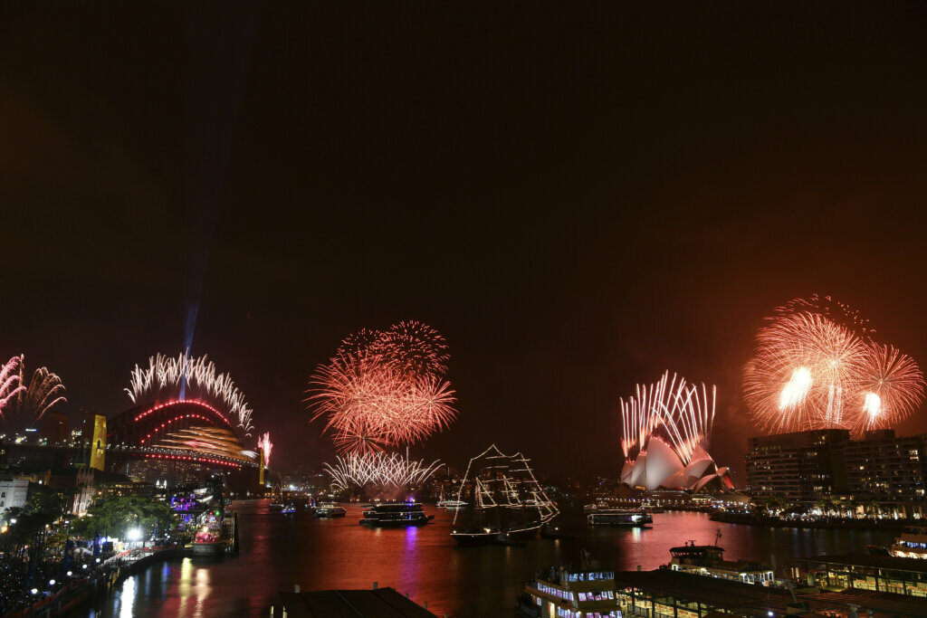 Fireworks explode over Harbour Bridge and the Sydney Opera House, as seen from Cahill Expressway during New Year celebrations in Sydney, Wednesday, Jan.1, 2020.