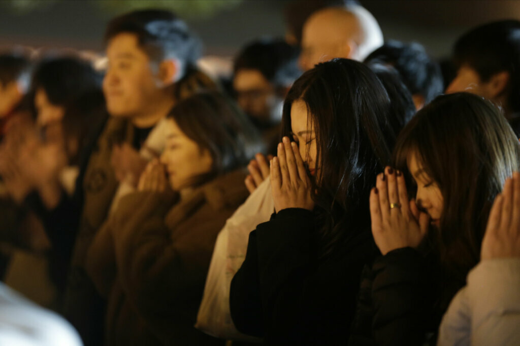 People offer their new year's prayers at the Meiji Jingu Shinto shrine as they celebrate the arrival of the year 2020, Wednesday, Jan 1, 2020, in Tokyo.