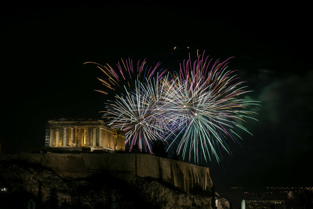 Fireworks explode over the ancient Parthenon temple at the Acropolis hill during the New Year's Eve celebrations in Athens, Wednesday, Jan. 1, 2020.