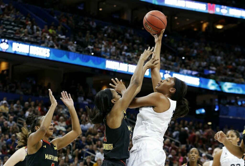 TAMPA, FL - APRIL 05: Morgan Tuck #3 of the Connecticut Huskies shoots against Shatori Walker-Kimbrough #32 of the Maryland Terrapins in the first half during the NCAA Women's Final Four Semifinal at Amalie Arena on April 5, 2015 in Tampa, Florida.