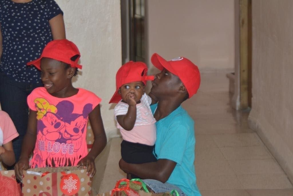 A Loudoun County, Virginia, family has become Santa for dozens of Dominican children with HIV.