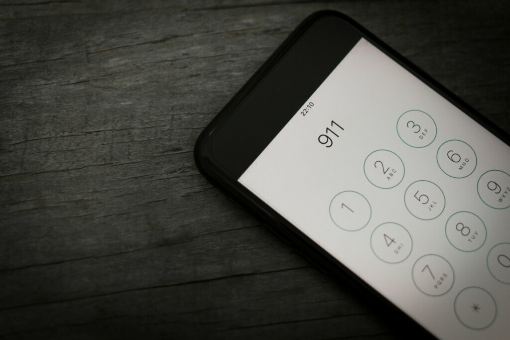 Emergency and urgency, 911 dialed on smartphone screen. Shallow depth of field.