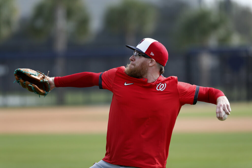 Washington Nationals pitcher Sean Doolittle throws during spring training baseball practice Friday, Feb. 14, 2020, in West Palm Beach, Fla.