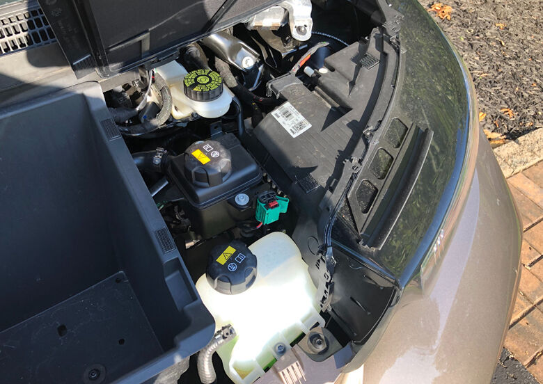 <p style="text-align: left;">A tiny 2 cylinder gas range extender doesn't live under the hood, but rather under the rear floor, allowing the i3 to keep going without having to plug in.</p>