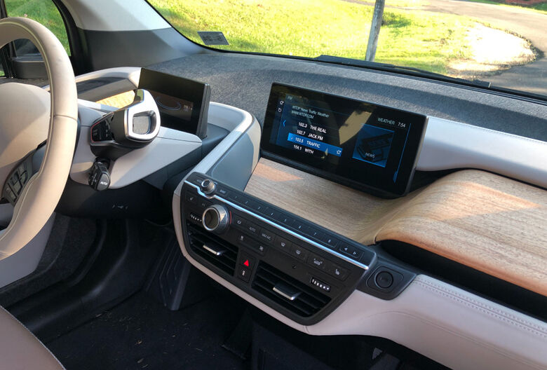 <p style="text-align: left;">The BMW i3 has a minimalistic dash and cockpit.</p>