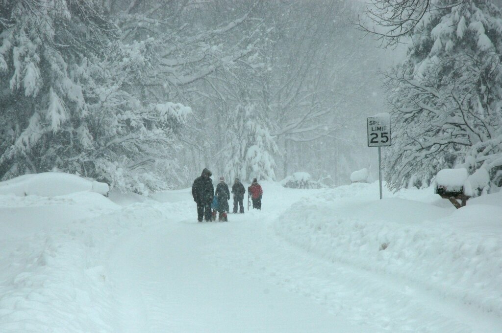 A family walks down a snow-covered street during the February 2010 storm.