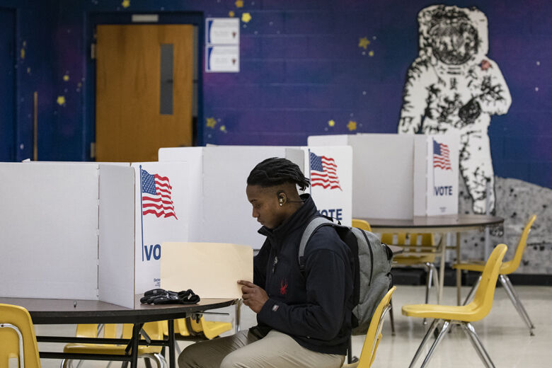 HERNDON, VA - MARCH 03: A voter fills in his ballots for the Democratic presidential primary election at a polling place in Armstrong Elementary School on Super Tuesday, March 3, 2020 in Herndon, Virginia. 1,357 Democratic delegates are at stake as voters cast their ballots in 14 states and American Samoa on what is known as Super Tuesday.