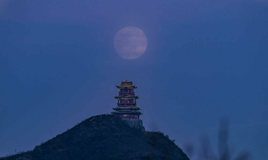 BEIJING, CHINA - MARCH 09: A supermoon rises above Dingdu Pavilion on March 9, 2020 in Beijing, China.