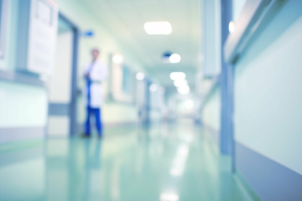 Doctor in hospital corridor, unfocused background
