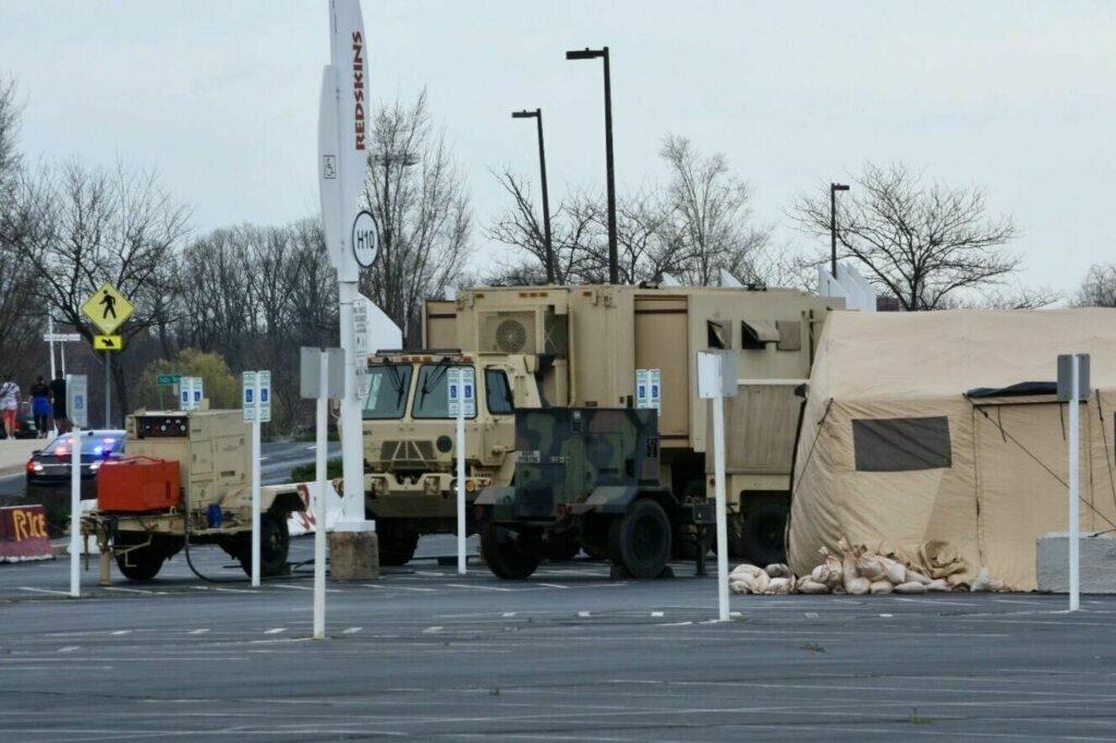 The Maryland National Guard is putting up tents at FedEx Field as part of a pilot program for screening on Friday, March 20, 2020. The goal for the site is to become a testing location in the future.