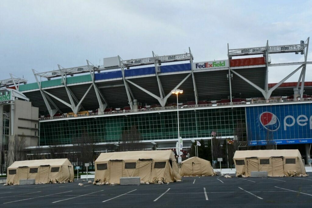 The Maryland National Guard is putting up tents at FedEx Field as part of a pilot program for screening on Friday, March 20, 2020. The goal for the site is to become a testing location in the future.