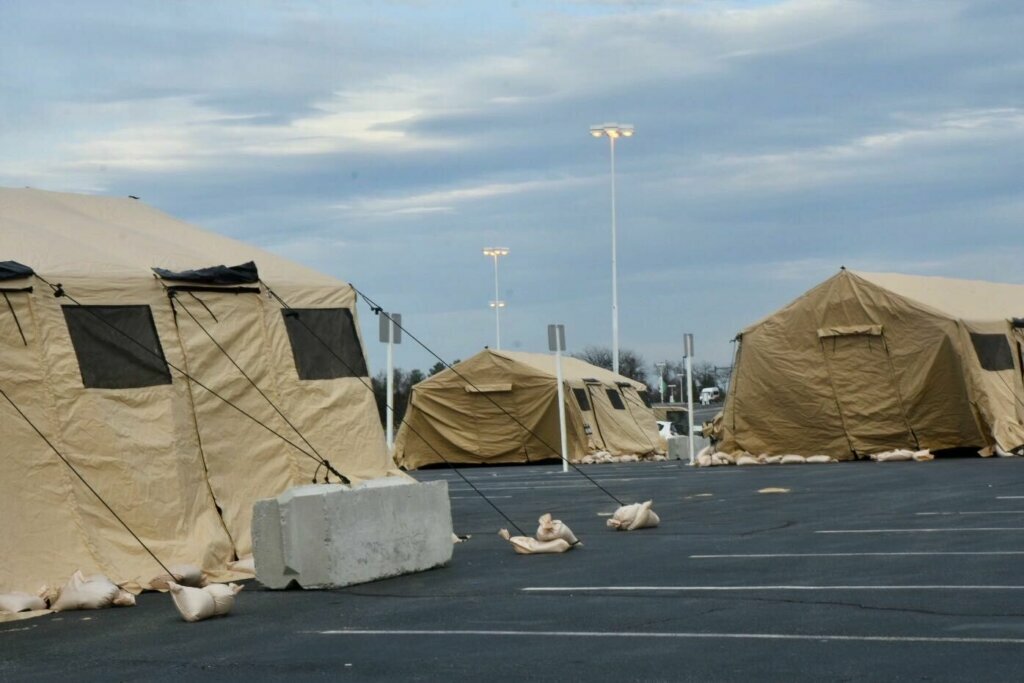 The Maryland National Guard is putting up tents at FedEx Field as part of a pilot program for screening on Friday, March 20, 2020. The goal for the site is to become a testing location in the future.