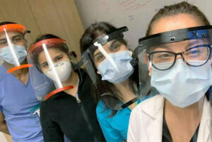 Medical staff from Elmhurst Hospital wearing the face shields