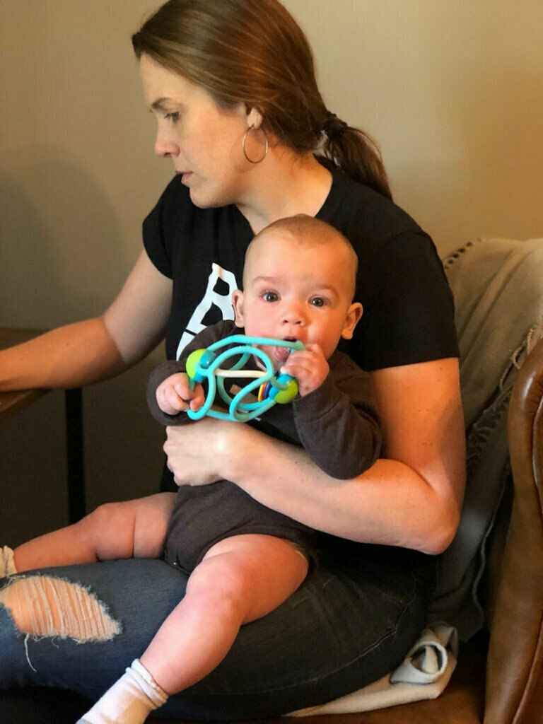 WTOP's Megan Cloherty works with her nephew on her lap. She finds working from home challenging. "Before the pandemic, I was accustomed to filing from the field. But working from home is a totally different animal. In our house, we are balancing childcare and trying to work around each other’s work demands. I’ve had to get used to watching press conferences on a live stream and calling in to ask my questions on a delay. We are getting a lot of great stories from community members who are sharing their new normal - what’s working and what’s not. It has been fun to break out of crime and courts reporting for a bit and tell different stories," she writes in an email. (WTOP/Megan Cloherty)