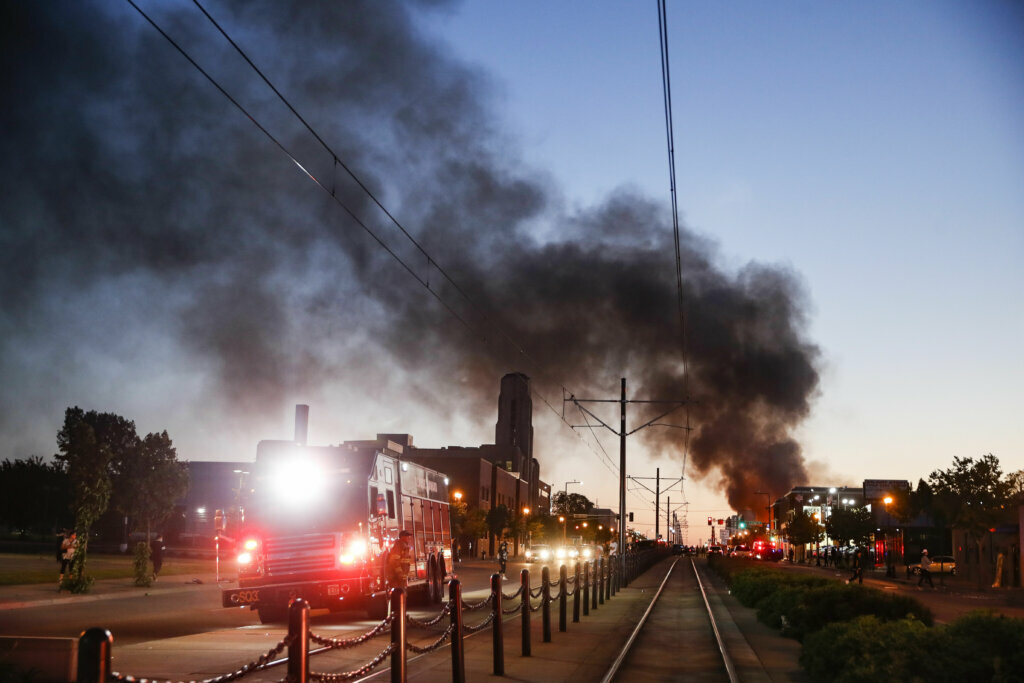 A building burns along University Avenue during a protest, Thursday, May 28, 2020, in St. Paul, Minn. Protests over the death of George Floyd, a black man who died in police custody Monday, broke out in Minneapolis for a third straight night. (AP Photo/John Minchillo)