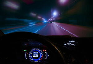 Car moving on highway at night