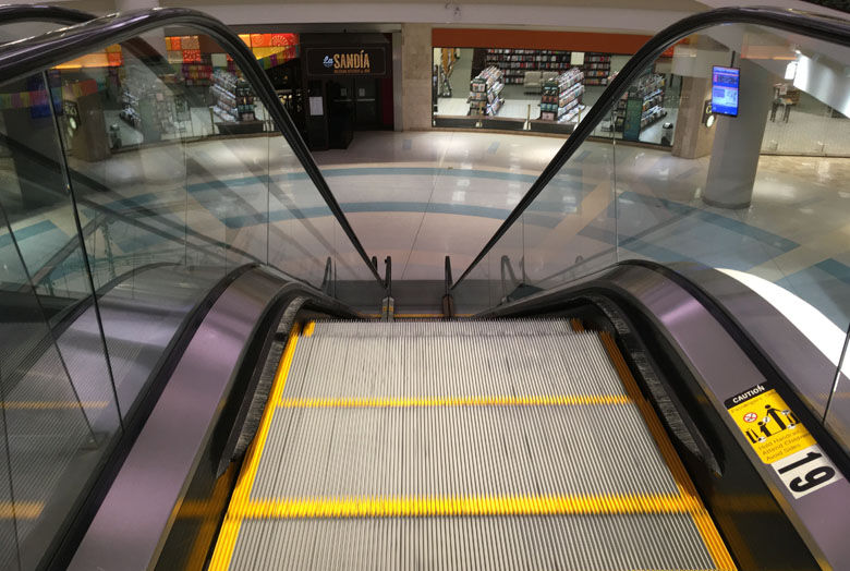 The escalator usually ferries shoppers down to the lower level in front of Barnes and Noble. Photo courtesy Dorothy Gundy.