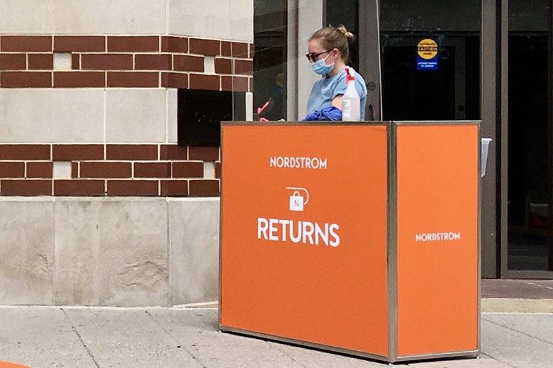 An employee waits to take returns for Nordstrom outside of the mall. Photo courtesy Dorothy Gundy.