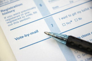 Voter Registration Vote by Mail with pen