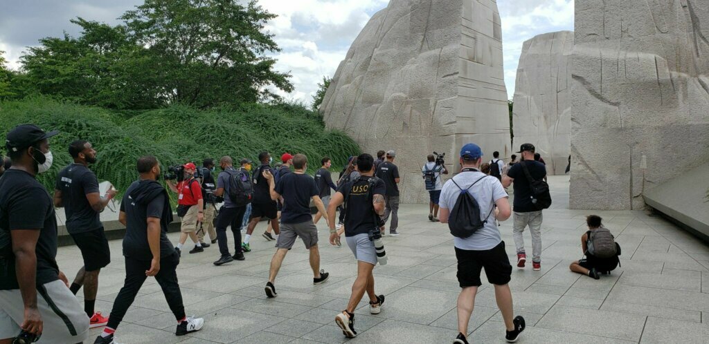 As they arrived at the Martin Luther King Monument, Wizards guard Bradley Beal and Mystics guard Natasha Cloud said this was only the first step in the march for social justice. (Dave Preston/WTOP)