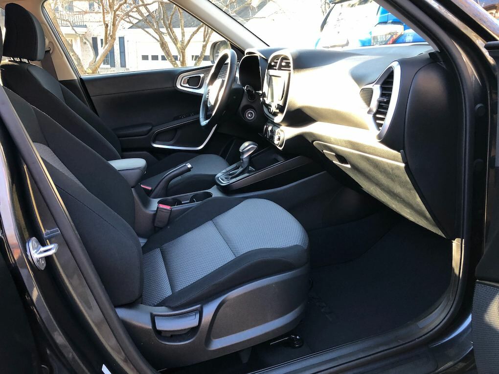A durable fabric covers the seats and the steering wheel and shift knob are covered in leather.