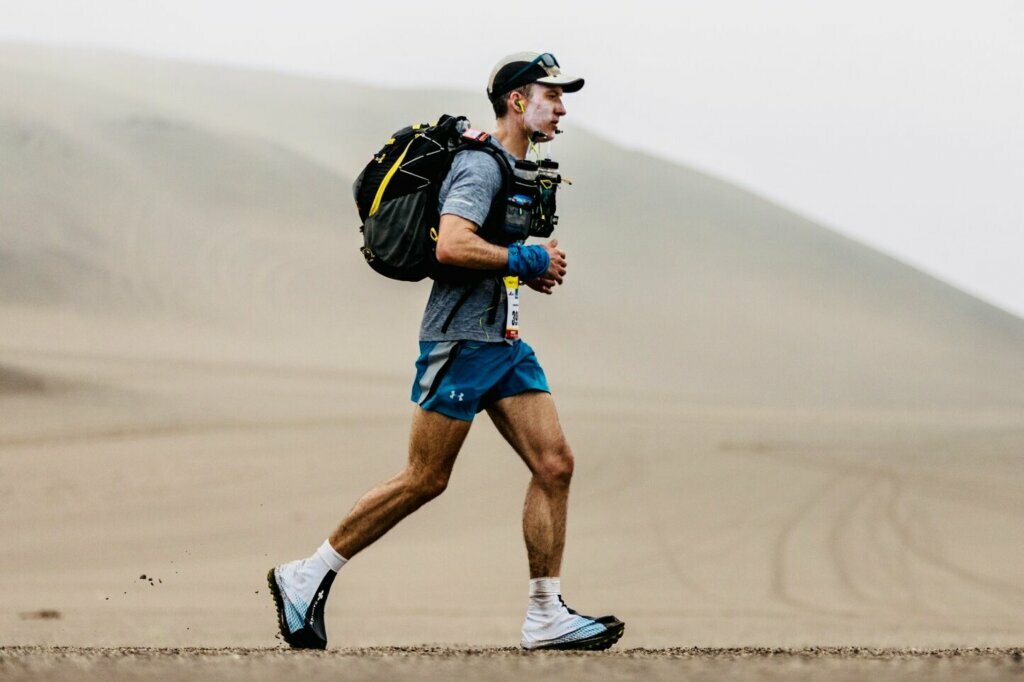 Corey Cappelloni runs through Peru's Ica Desert in 2019.