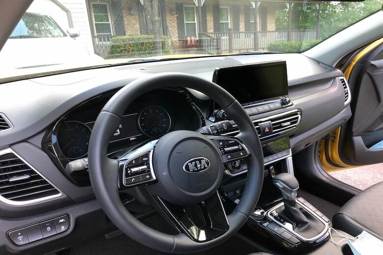 The Kia might be more diminutive in size, but its rear seats are good for average size adults and even some useable cargo space. (WTOP/Mike Parris)