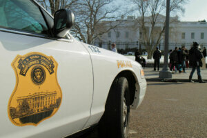 Secret Service, police car outside The White House.