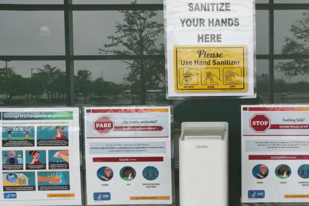 Signs about social distancing and coronavirus precautions are seen at the Super Pet Expo in Chantilly, Virginia. (Courtesy Jill Collins)