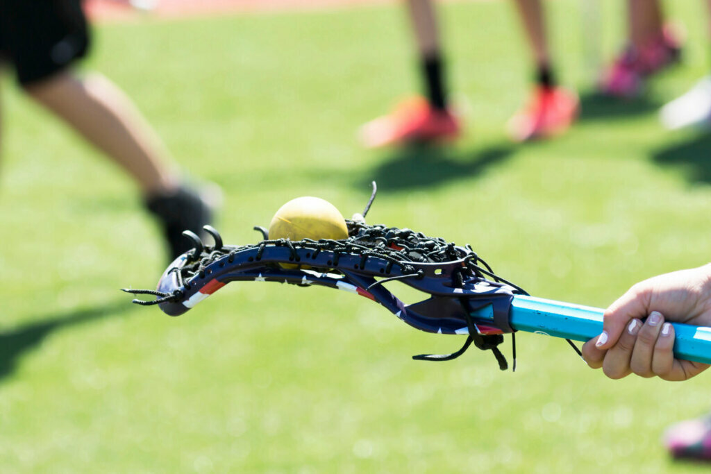 Lacrosse stick with ball on the back