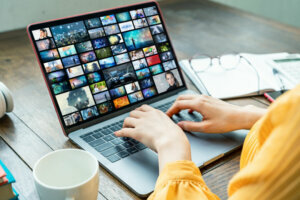 Young woman using a laptop computer. Graphic designer. UX design.