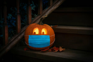 Lighted Halloween Pumpkin Jack o Lantern Wearing Covid PPE Mask On Steps
