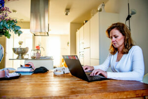 A woman working from home as a preventive measures against